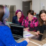 What is the role of a business consultant in the decision-making process and how does it contribute to more efficient management?